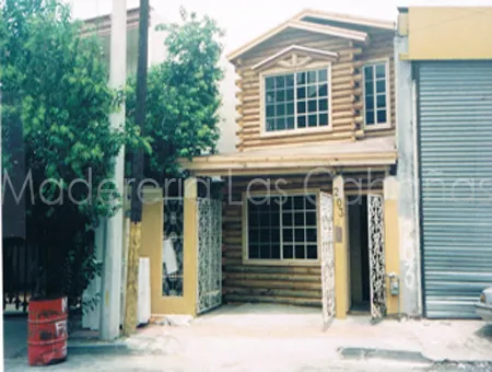 Cabaña en segundo piso de casa-habitación y recubrimiento de fachada de medio tronco