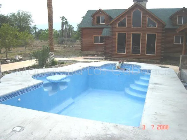 Alberca y cabaña